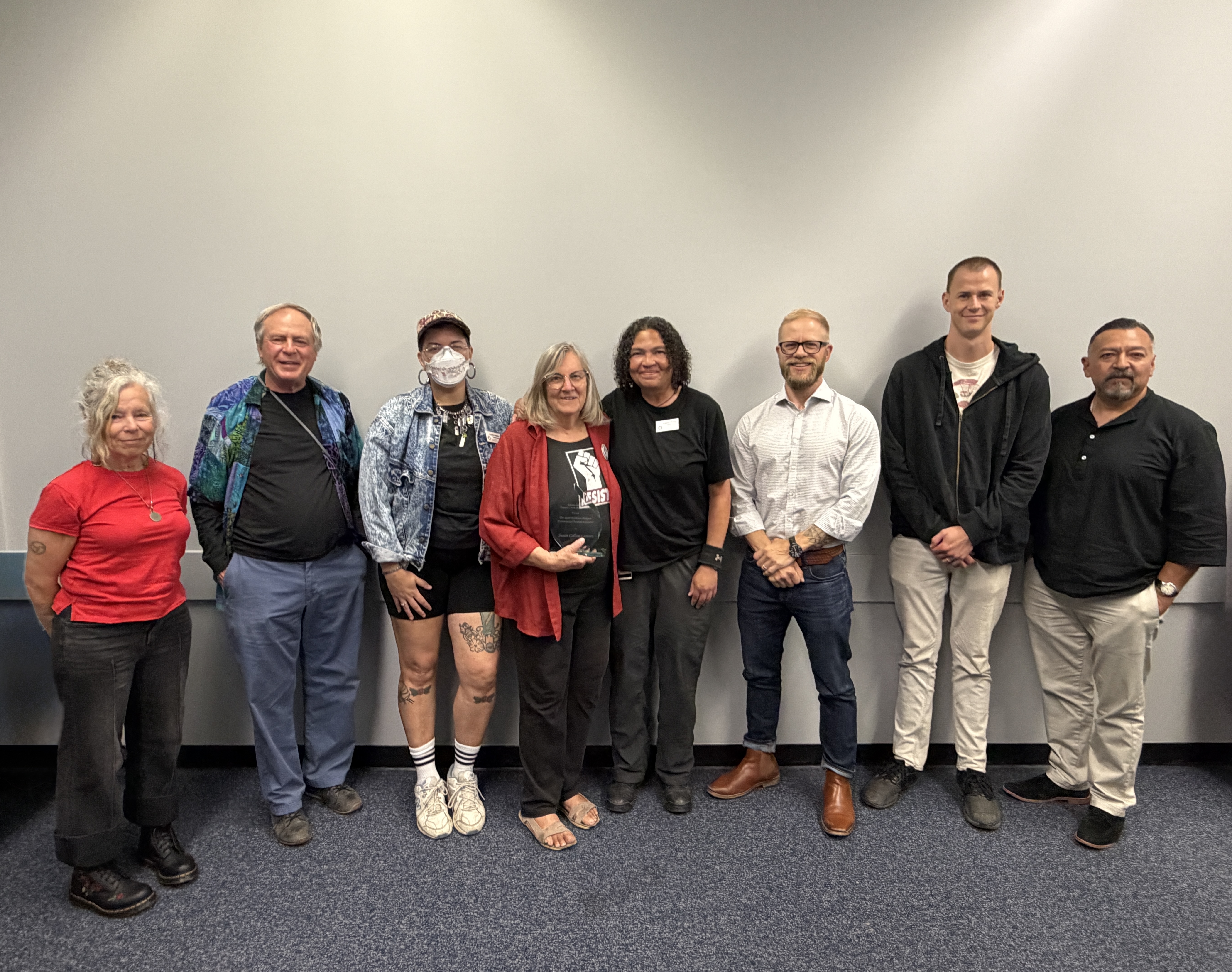 The Commission on Human Rights and Susan Lamont posing for a picture