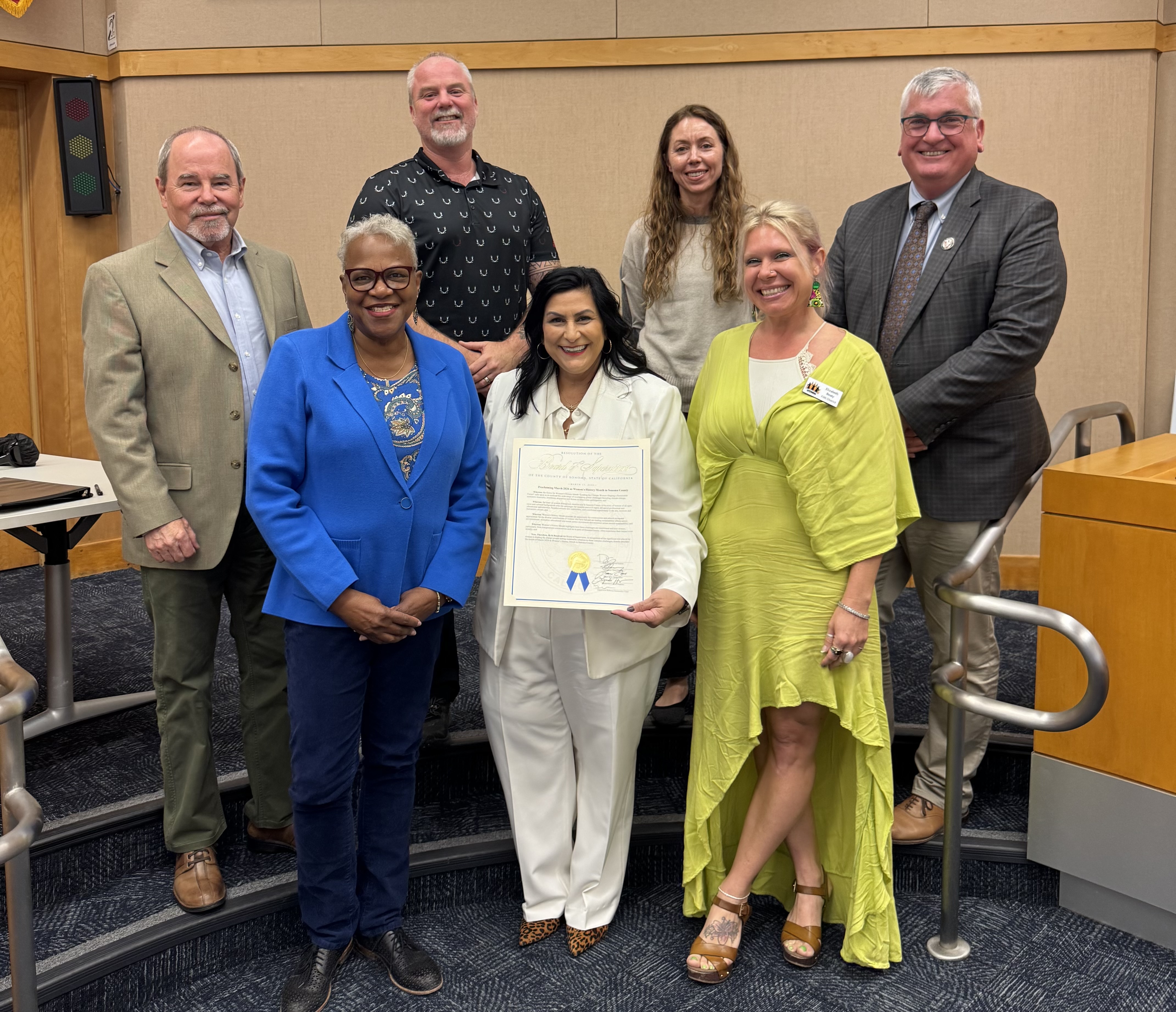 The Commission accepting a gold resolution from the Board of Supervisors