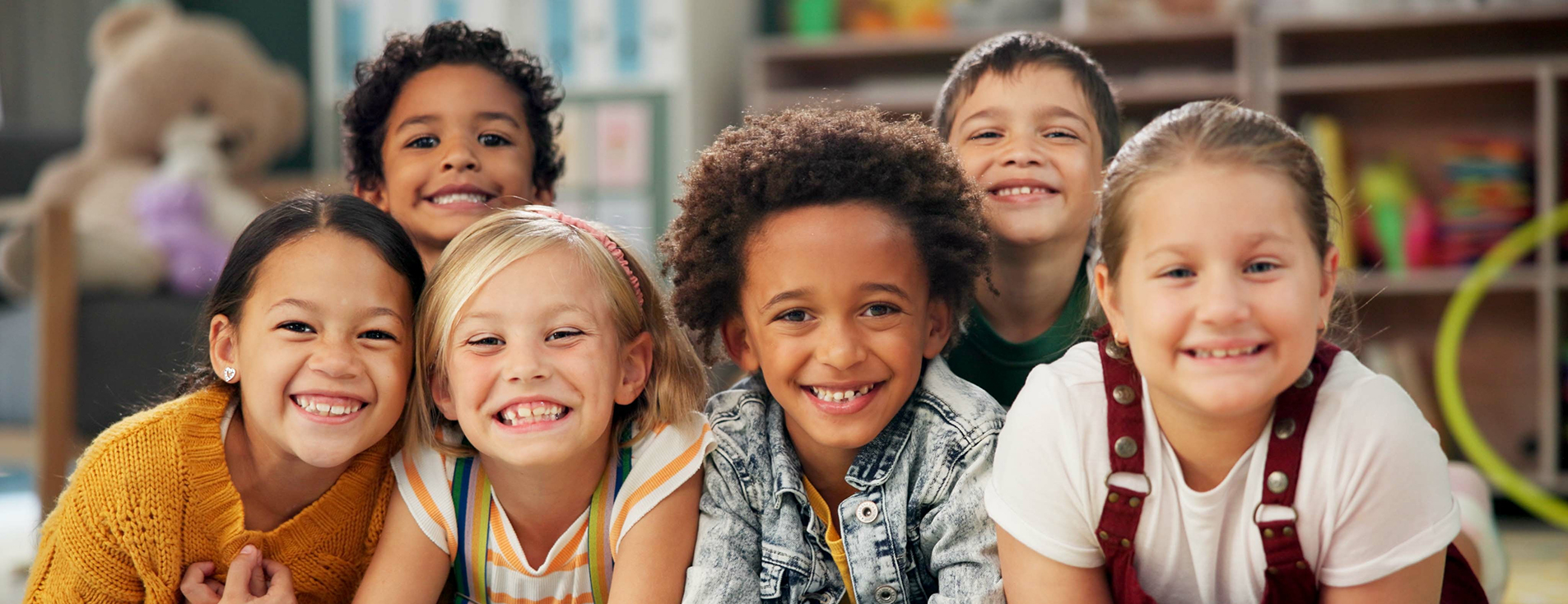 Children leaning against a table