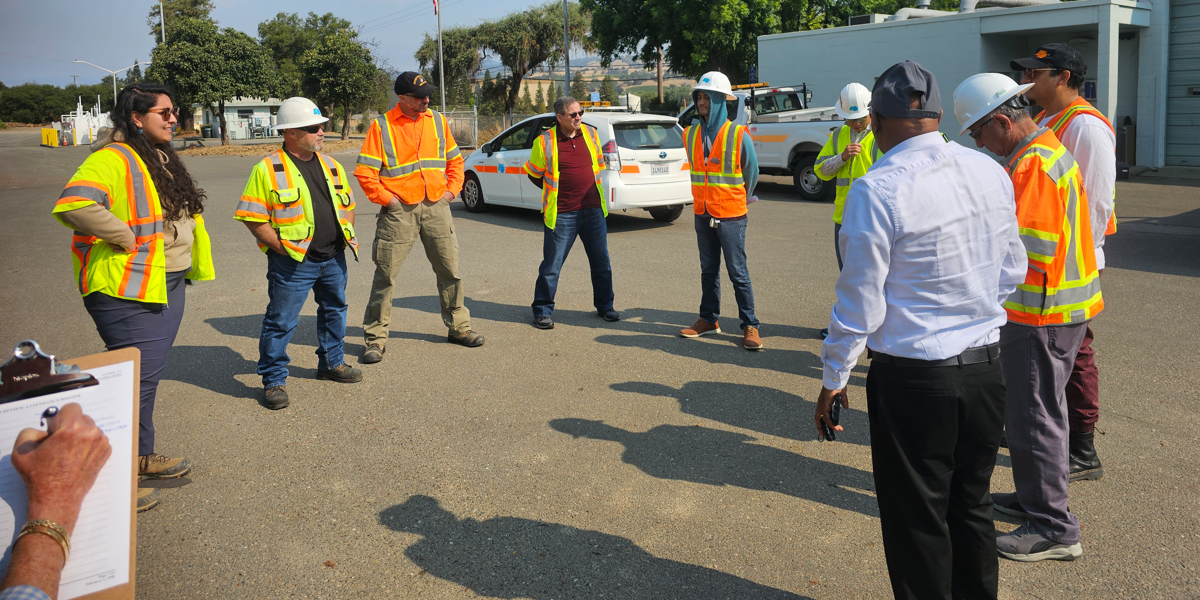 Group of people meeting outside to discuss road improvements