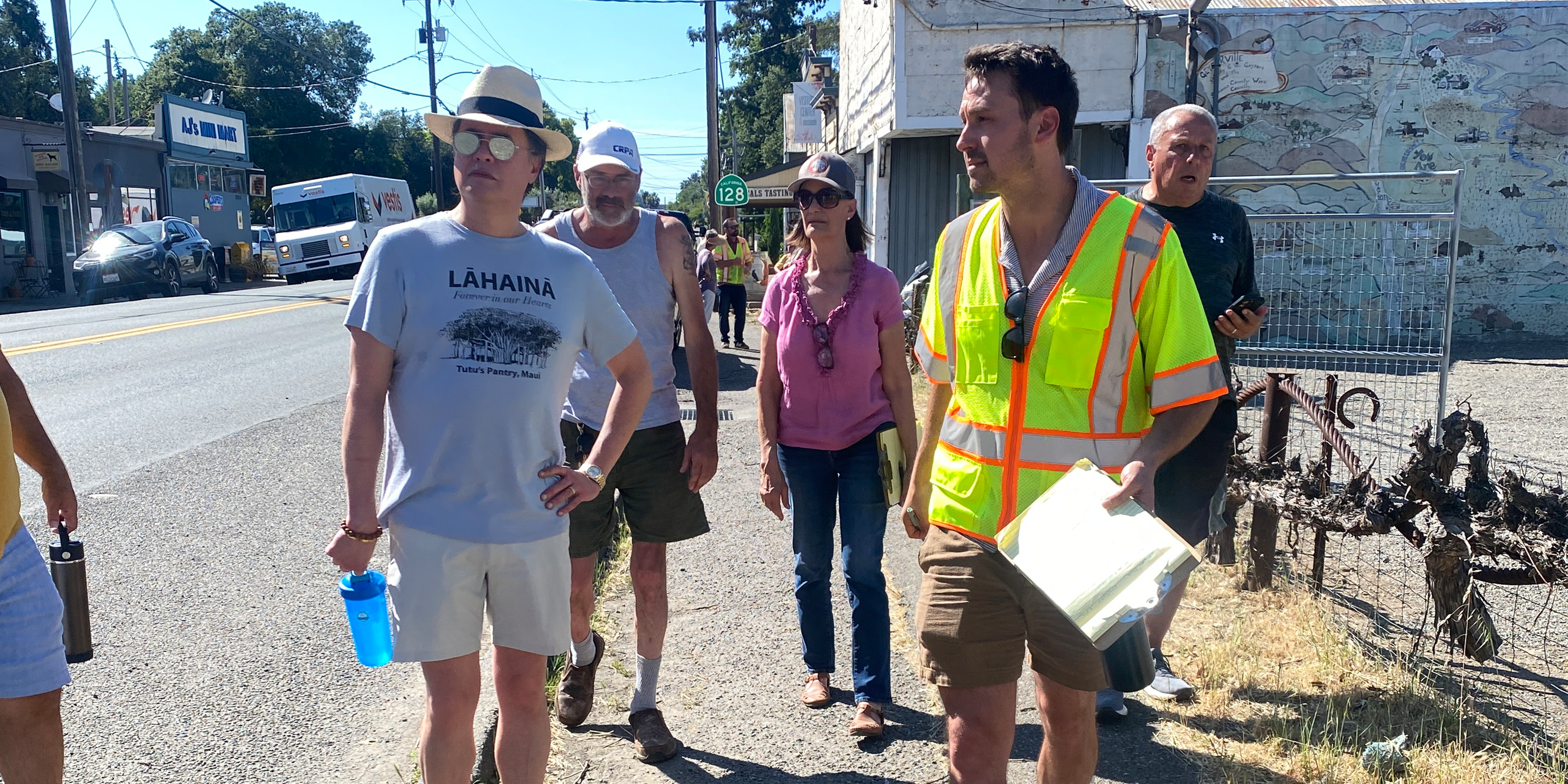 Group of people walking a street where road improvements are proposed