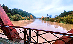 Flooded river from bridge image